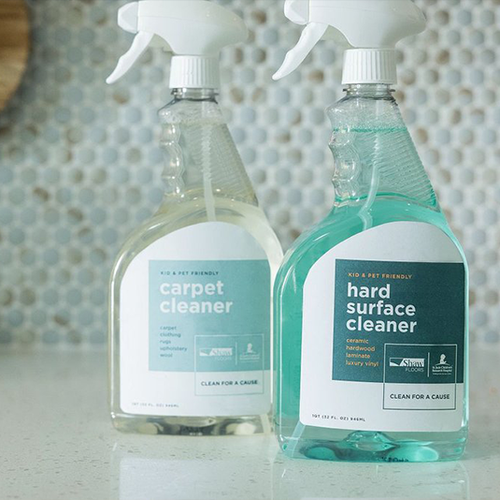 two bottles of cleaning solution on kitchen counter